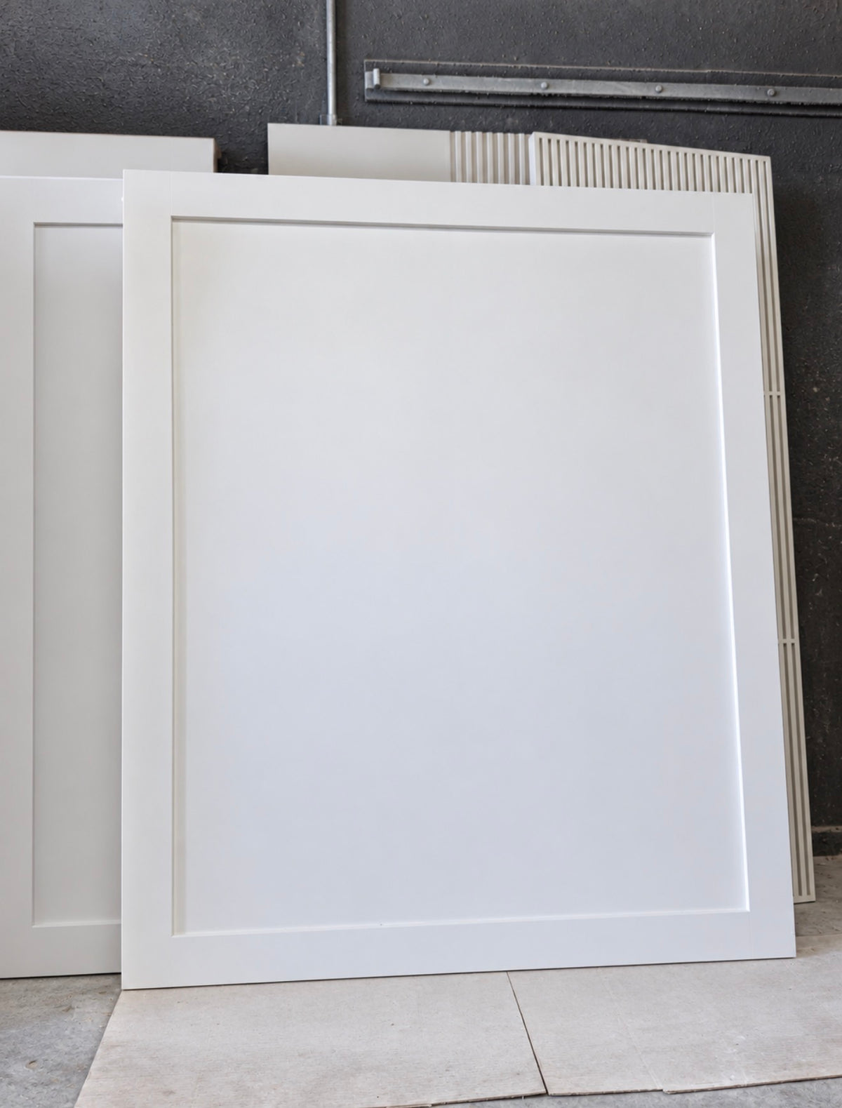 White full panel custom wood interior door handcrafted by Rustic Luxe Designs