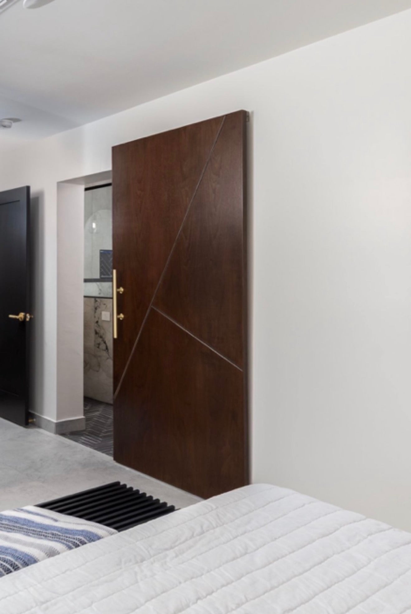 Vector Offset architectural interior door with angled panel detailing in stained wood, modern architectural luxury design.