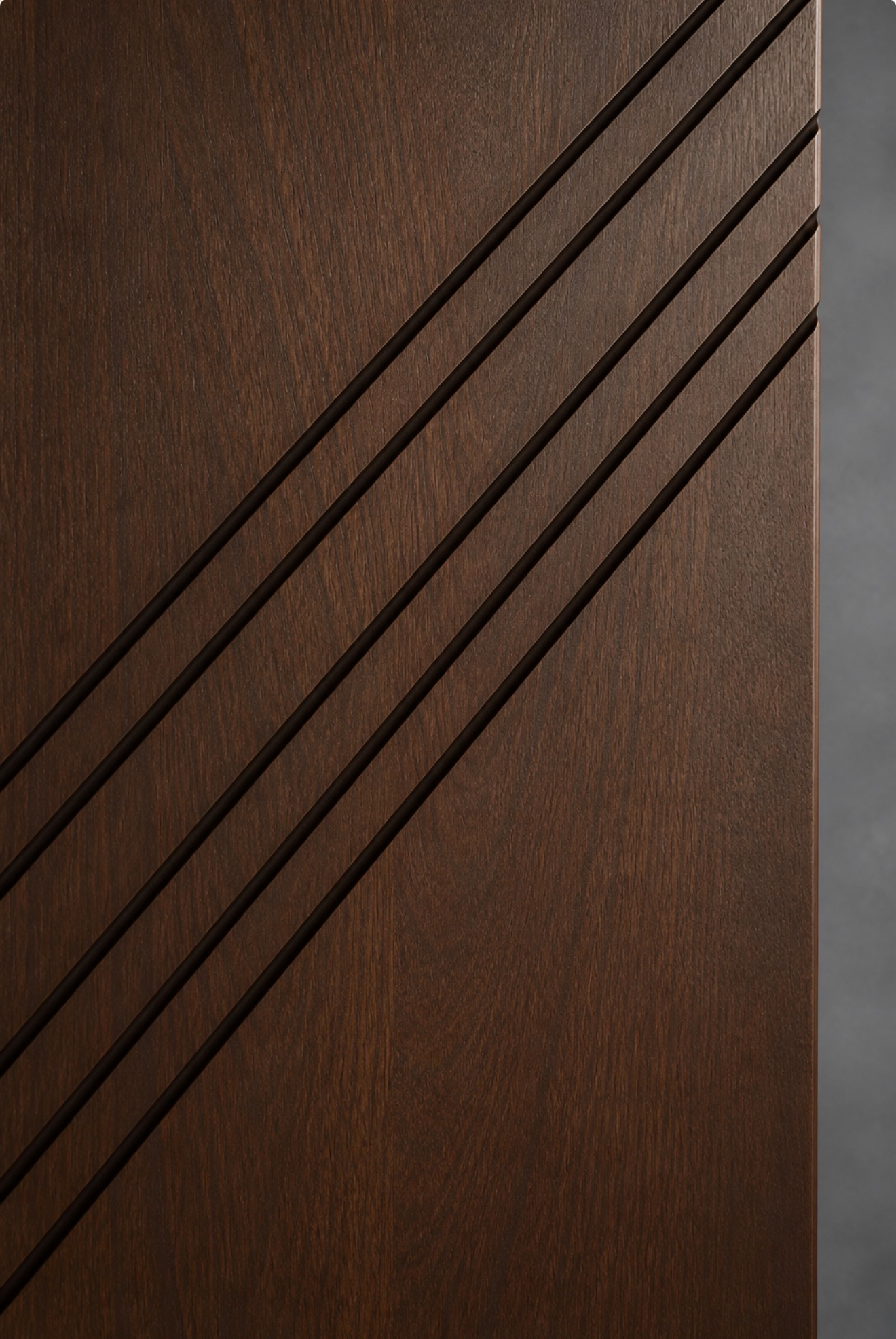 Close-up of Amancio custom wood door with rich walnut grain and diagonal architectural detailing.
