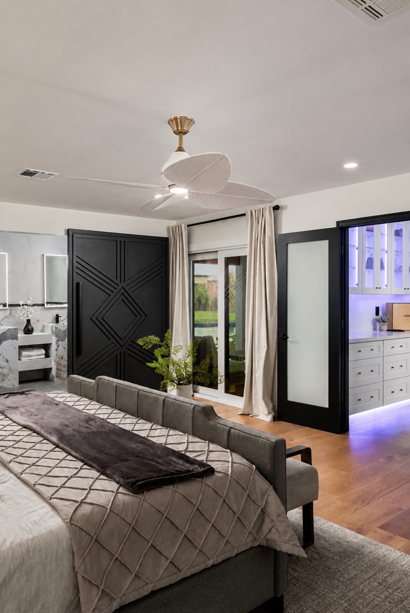Modern primary bedroom featuring the Giza Grand black geometric sliding door
with an invisible concealed sliding track