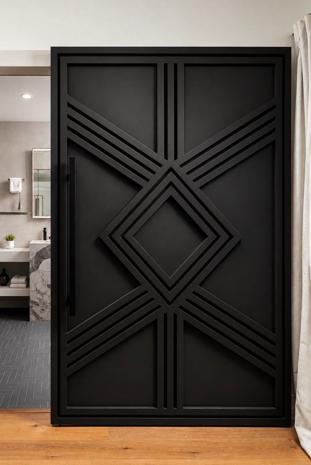 Giza Grand black geometric sliding door with raised Art Deco detailing installed with a concealed track and elongated square handle
