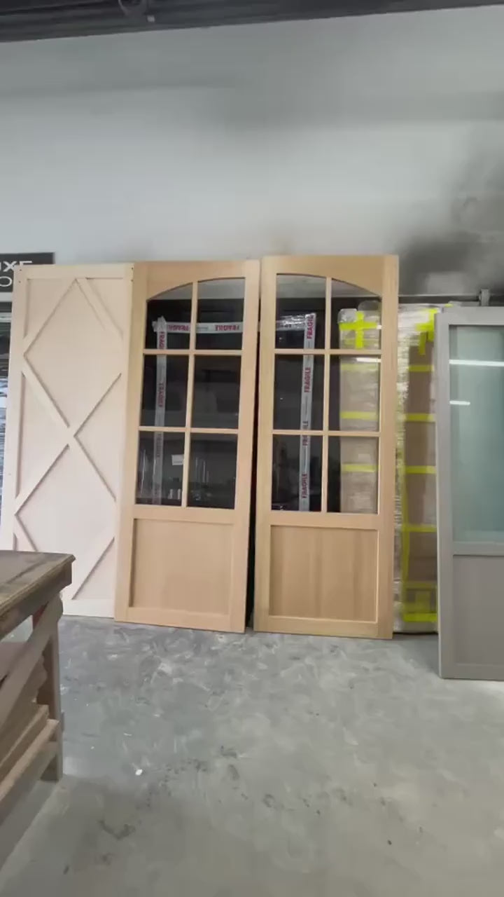 Tuscan arched glass door in Rift White Oak with natural stain and clear tempered glass