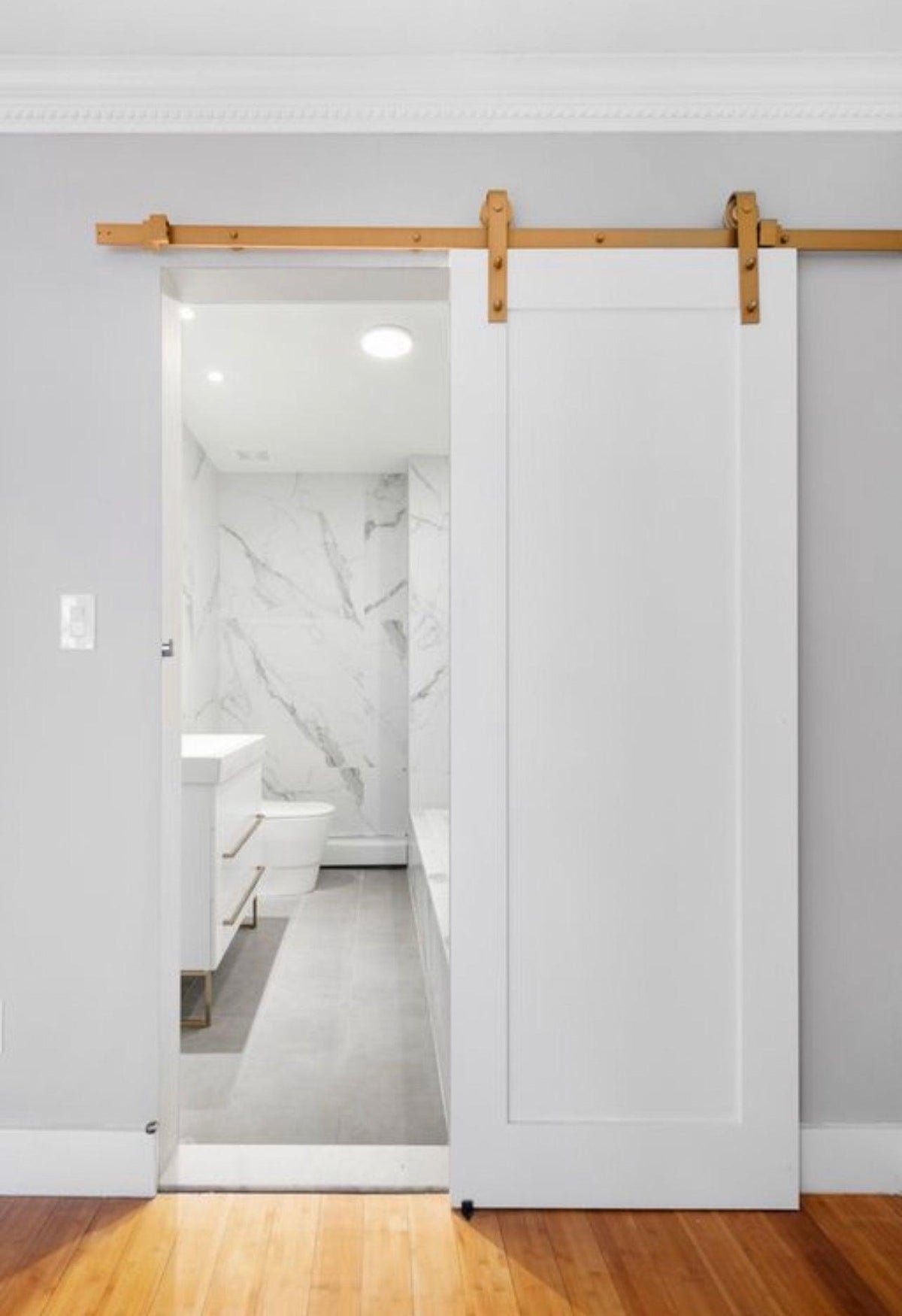 Full Panel Door - Rustic Luxe Designs  A smooth maple slab, framed with precision, painted a soft white with luxurious golden door hardware.